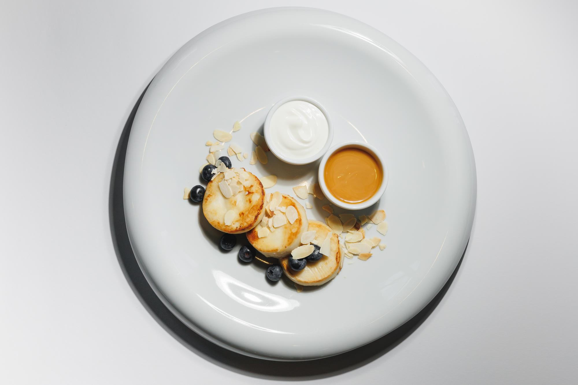 Editorial shot large plated tasting menu on table